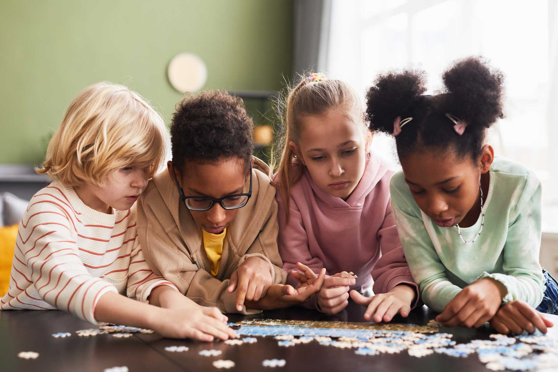 Students working together on a classroom puzzle